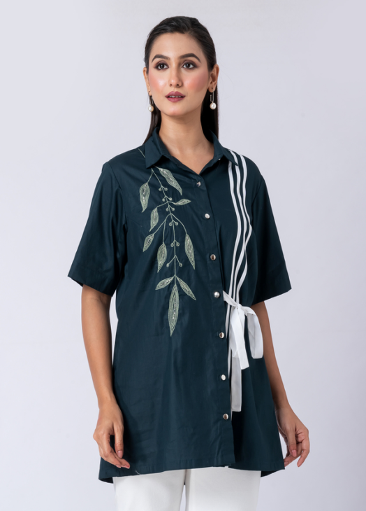 A vibrant green cotton shirt, adorned with stunning bead and hand embroidery. With a classic collar and half sleeves, it's perfect for a sophisticated yet comfortable Western look.