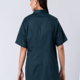 A vibrant green cotton shirt, adorned with stunning bead and hand embroidery. With a classic collar and half sleeves, it's perfect for a sophisticated yet comfortable Western look.