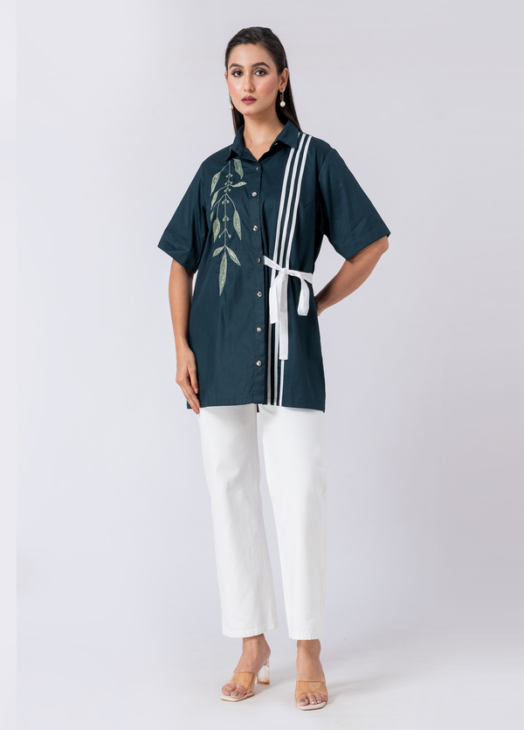 A vibrant green cotton shirt, adorned with stunning bead and hand embroidery. With a classic collar and half sleeves, it's perfect for a sophisticated yet comfortable Western look.